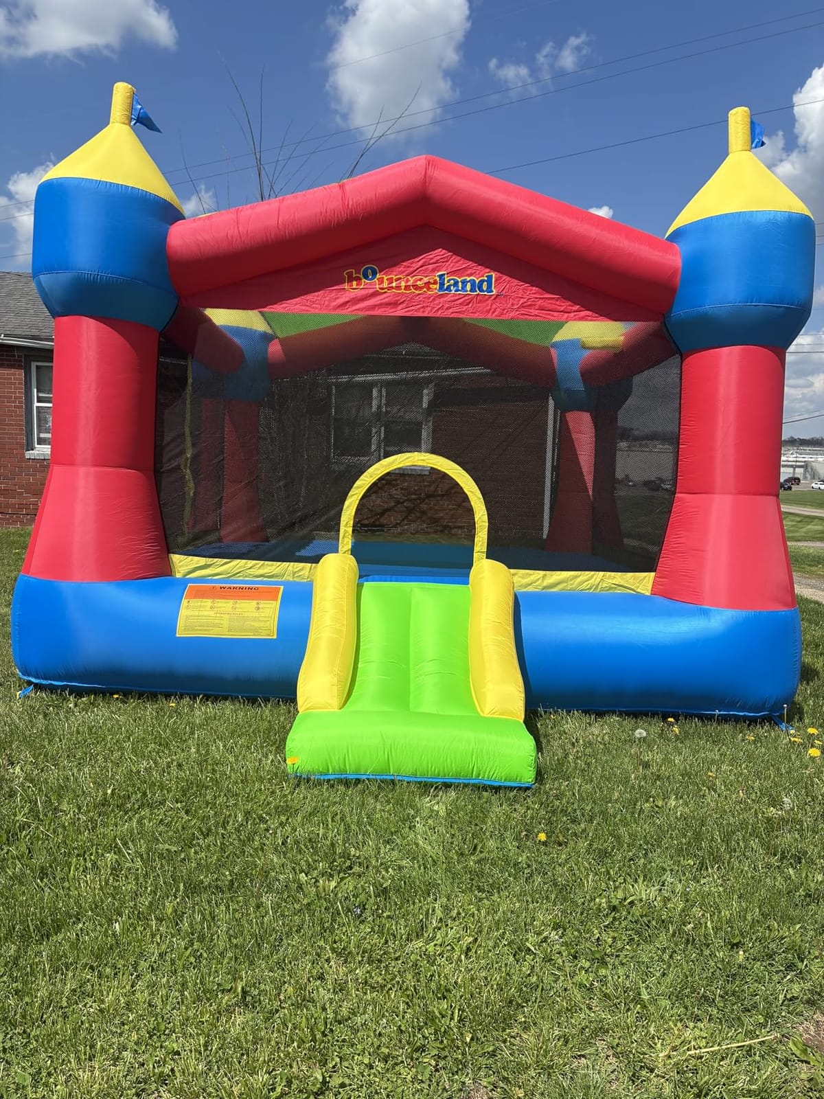 Bounceland Inflatable Party Castle Bounce House Bouncer, 16 ft L x 13 ft W x 10.3 ft H, Basketball Hoop, Removable Sun Roof, UL Strong Blower included, Fun Slide and Bounce Area, Castle Theme for Kids customer photo 1