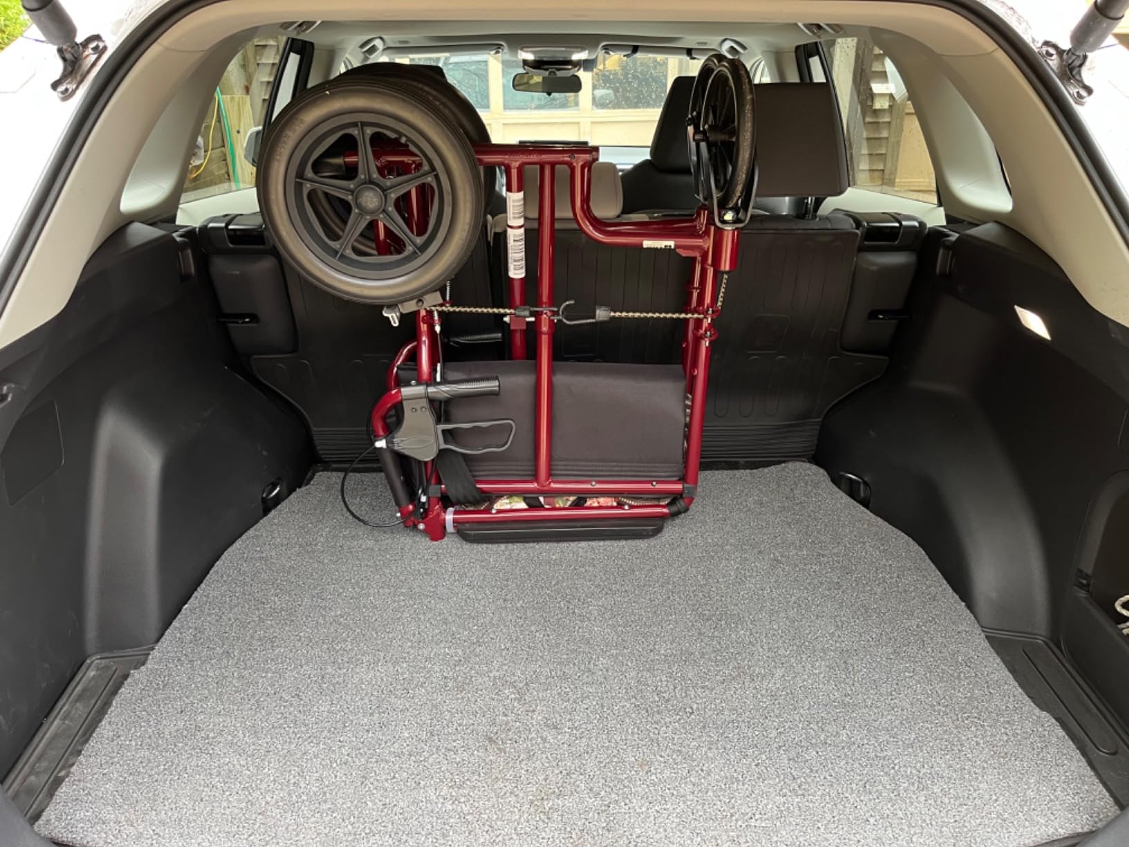 Medline Lightweight Foldable Transport Wheelchair with Handbrakes and 12-Inch Wheels, Red Frame, Black Upholstery customer photo 2