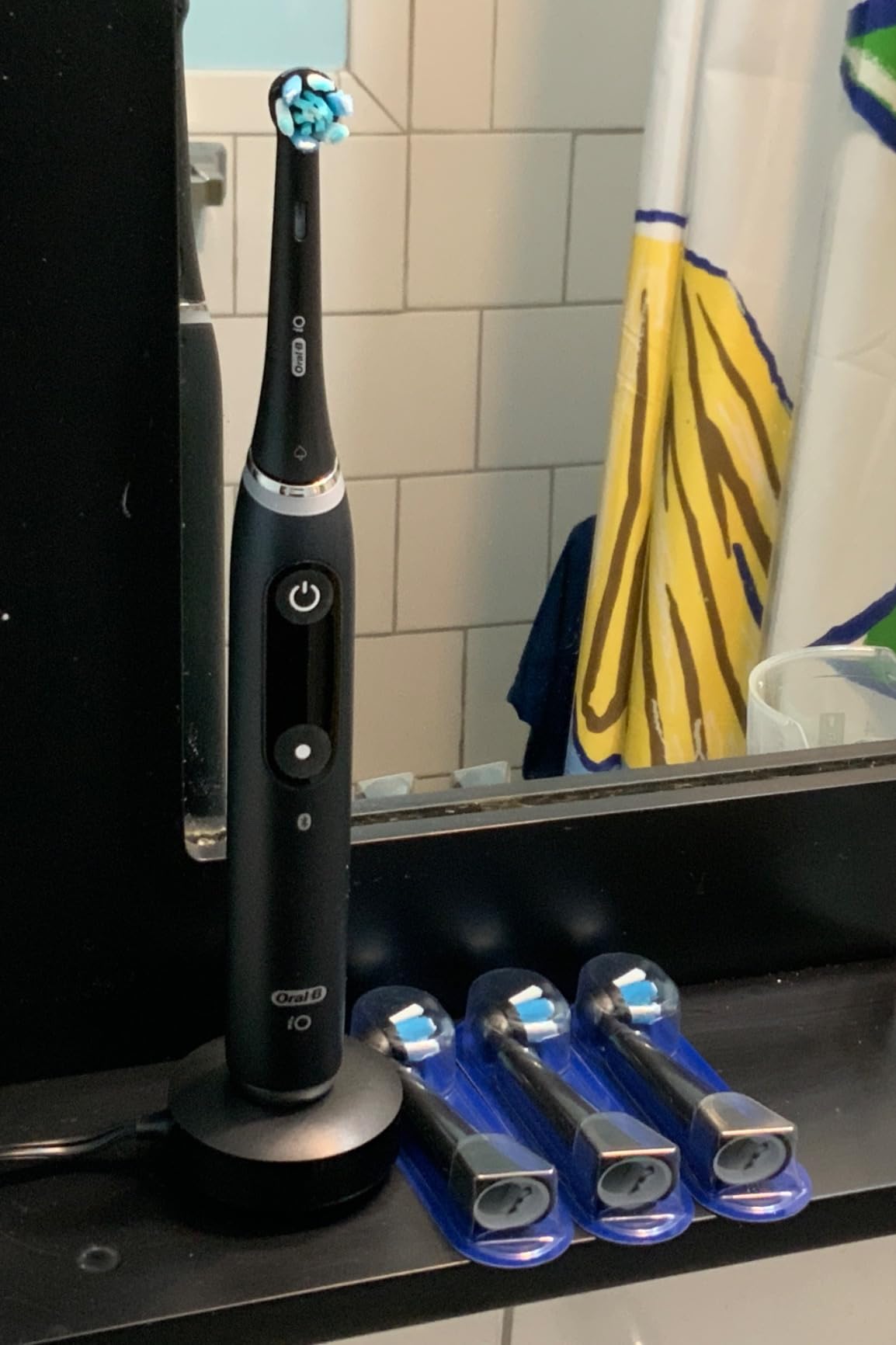 Oral-B Rechargeable Electric Toothbrush, iO Series 9 Genius, Black, 4 Replacement Brush Heads, Power Charging Travel Case, Teeth Whitening, Visible Pressure Sensor to Protect Gums, 7 Modes customer photo 2