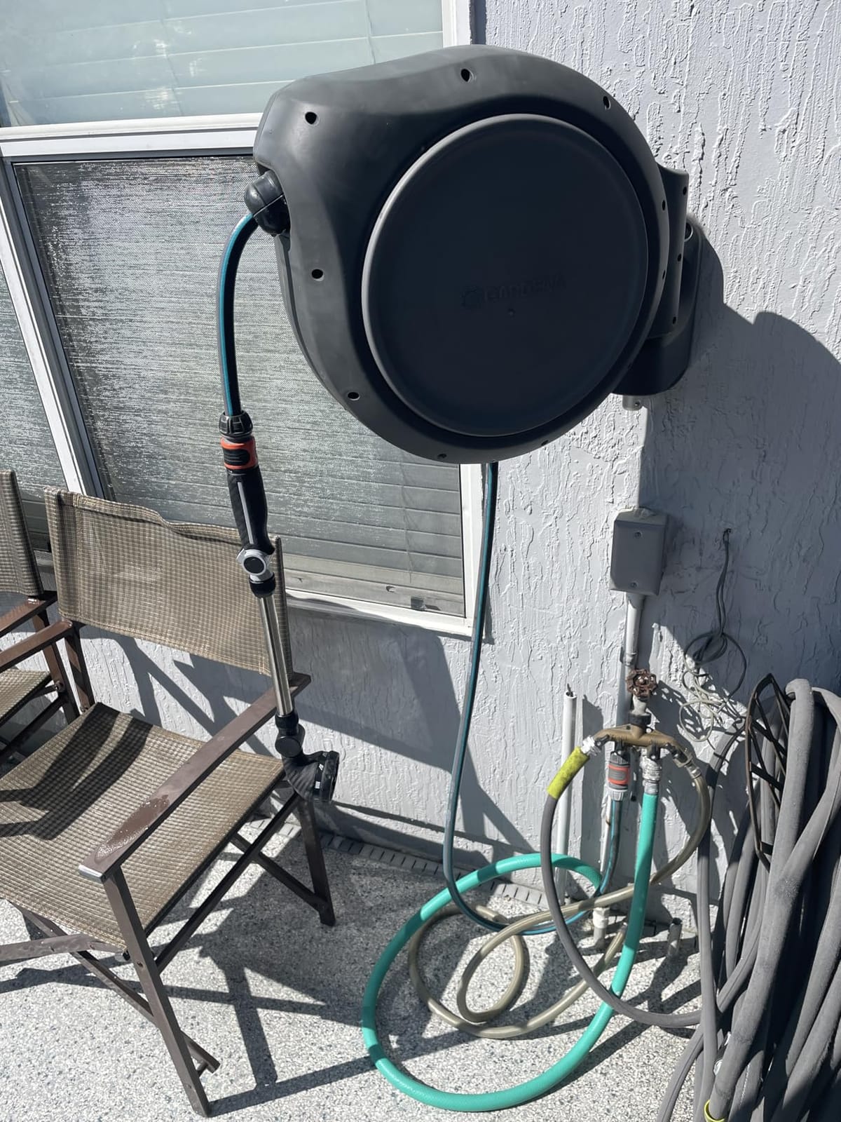 GARDENA Retractable Garden Hose Reel - 100 Feet - Auto Retract Hose Reel with 180° Swivel Wall Mount - Heavy Duty - Includes Spray Nozzle - 20505 customer photo 2